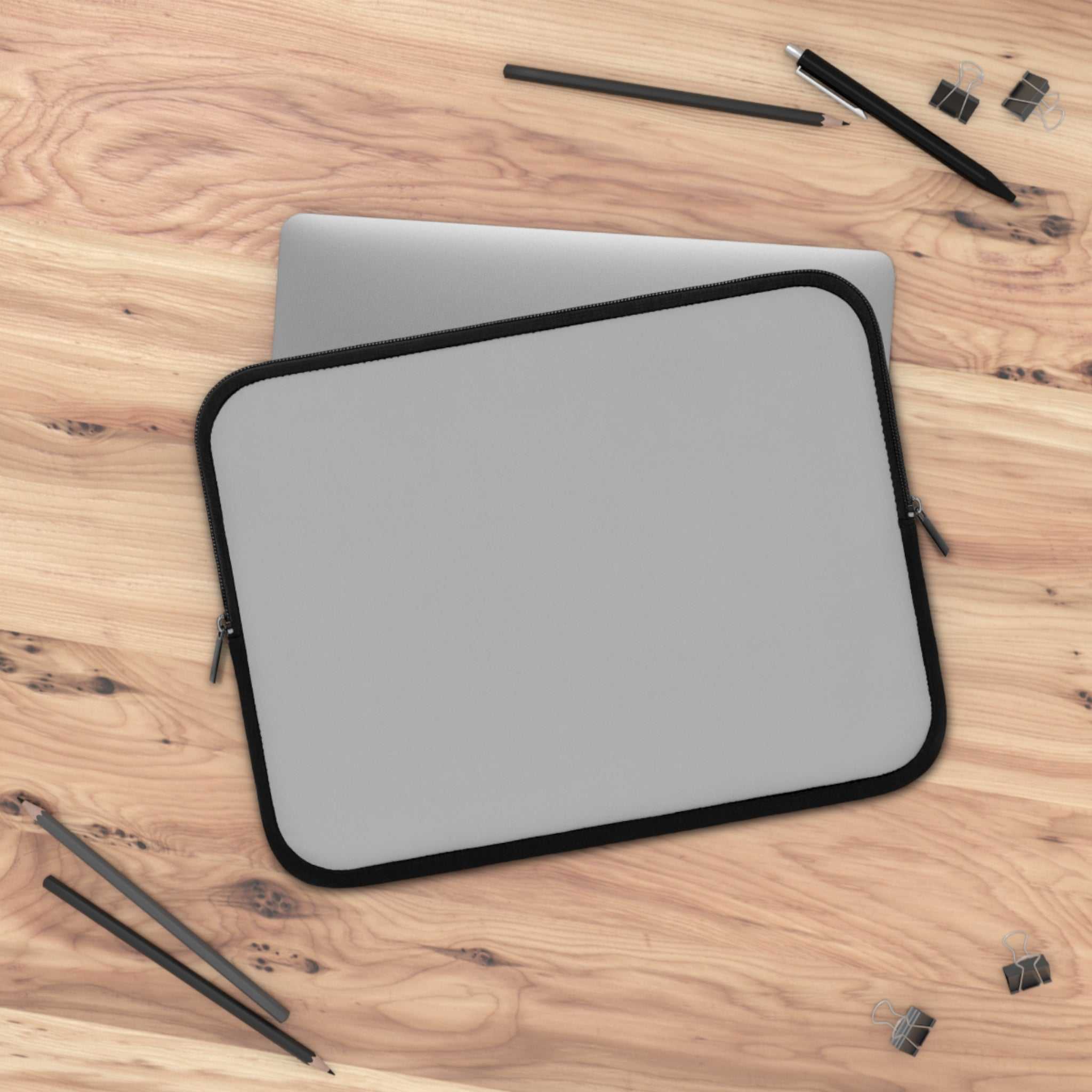 silver neoprene laptop sleeve with black trim, soft foam lining, dual zipper, lightweight and waterproof protective case