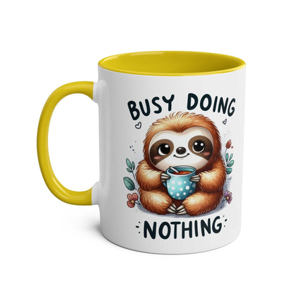 Cute sloth coffee mug with whimsical design, colorful handle, and glossy finish.