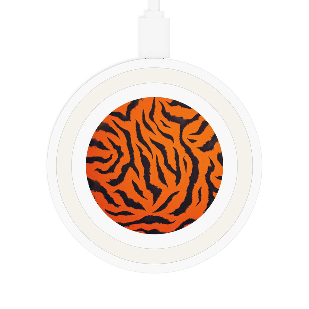 White wireless charging pad with bright orange tiger print design and USB cable