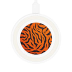 White wireless charging pad with bright orange tiger print design and USB cable