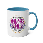 Everyone Annoys Me But You coffee mug with floral design and blue handle.