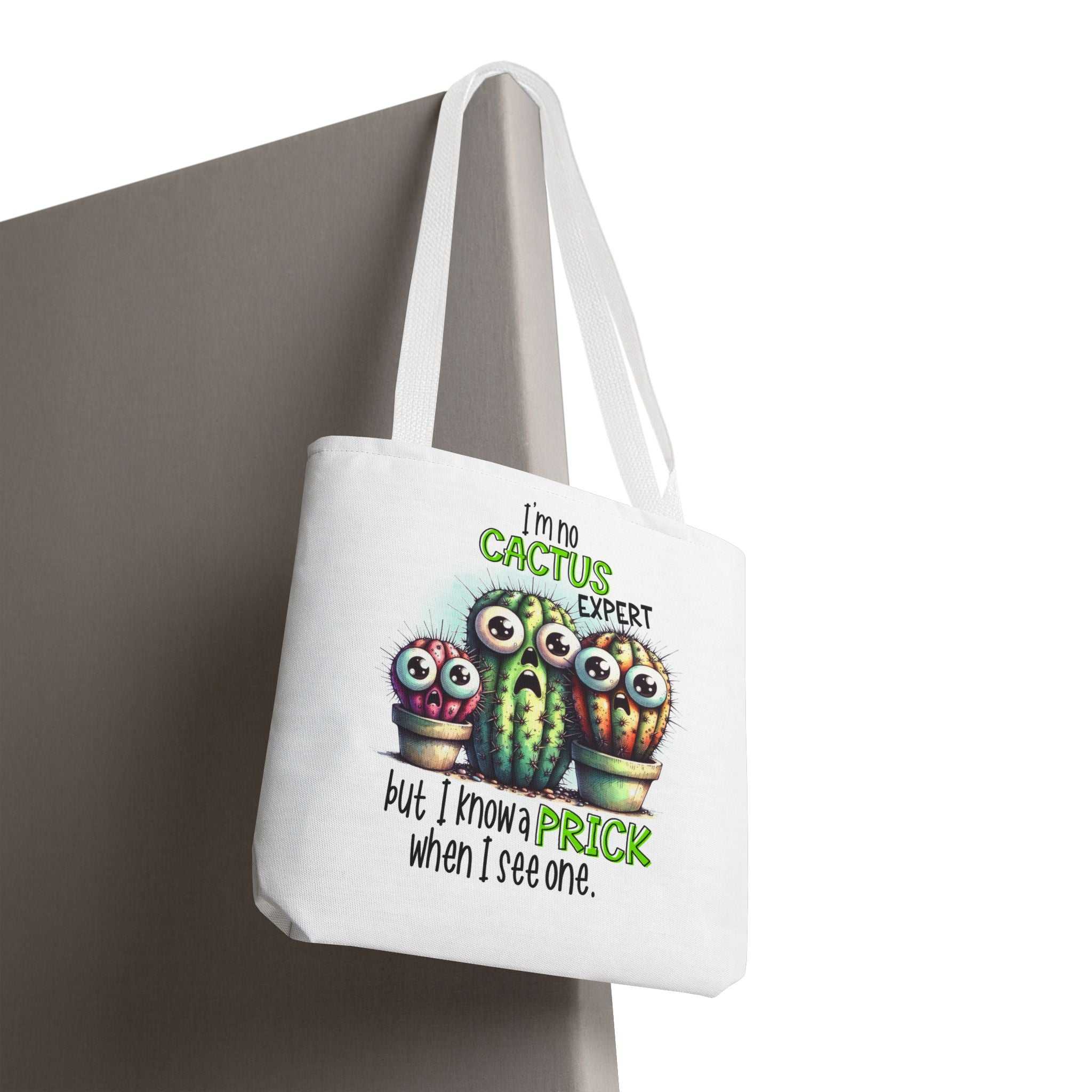 Fun cactus tote bag with cheeky design, multiple sizes, durable spun polyester, and colorful handles