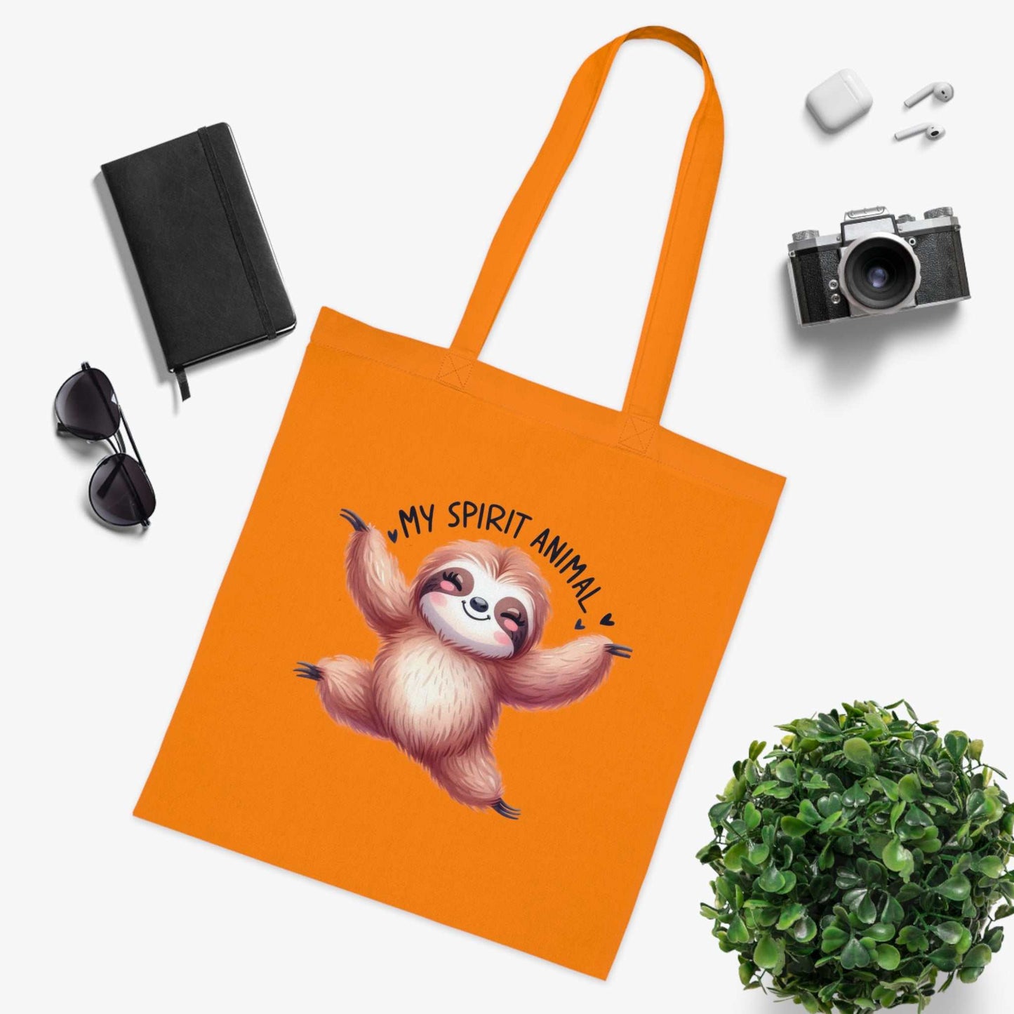 Cotton tote bag with cute sloth design, vibrant colors, ideal for sloth lovers and fun daily use.