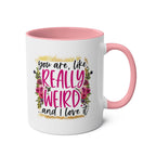 really weird coffee mug with pink interior and humorous text
