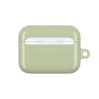 Sage green hard shell AirPods protective case with glossy finish and wireless charging compatibility