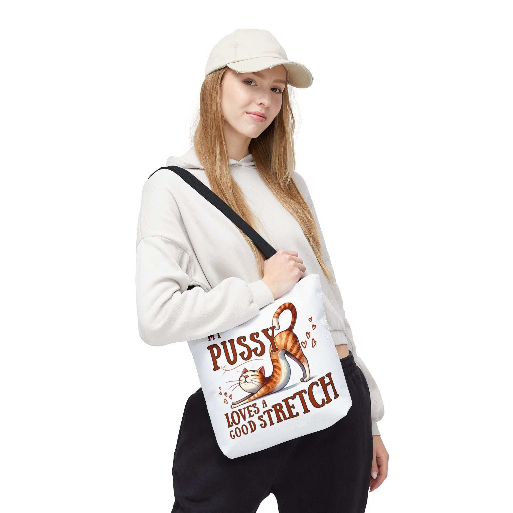 Fun stretching cat tote bag with cheeky printed design and multiple handle color options