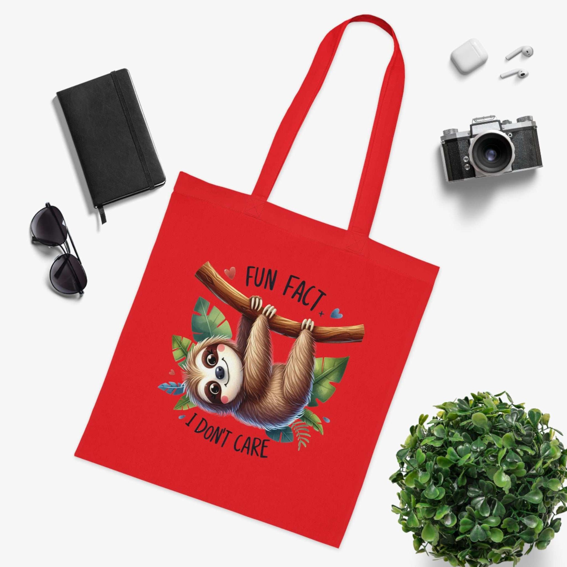 Cute sloth design cotton tote bag in red, perfect for carrying essentials with style.