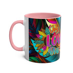 Vibrant LGBTQ+ Pride mug with rainbow design and pink handle.