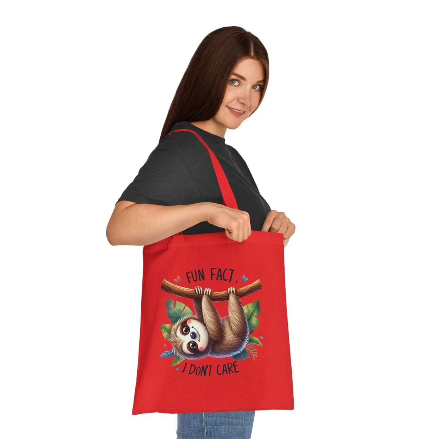 Red cotton tote bag with cute sloth design, vibrant colors, and reinforced handles.