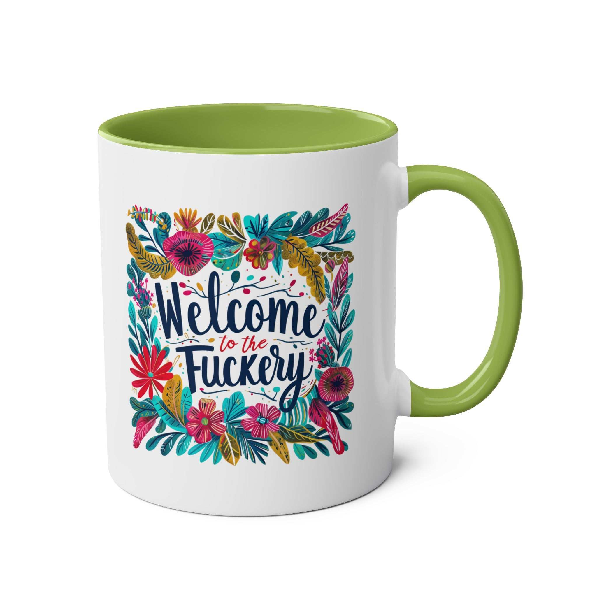 Colorful "Welcome To The Fuckery" coffee mug with floral design and green interior.