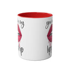 Ceramic mug with "You Make My Lips Drip" design, glossy white with red rim and handle.