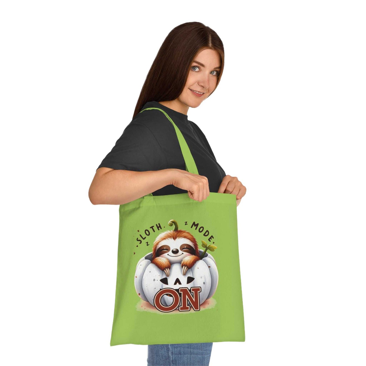 Cute sloth cotton tote bag in vibrant green, perfect for carrying essentials with style.