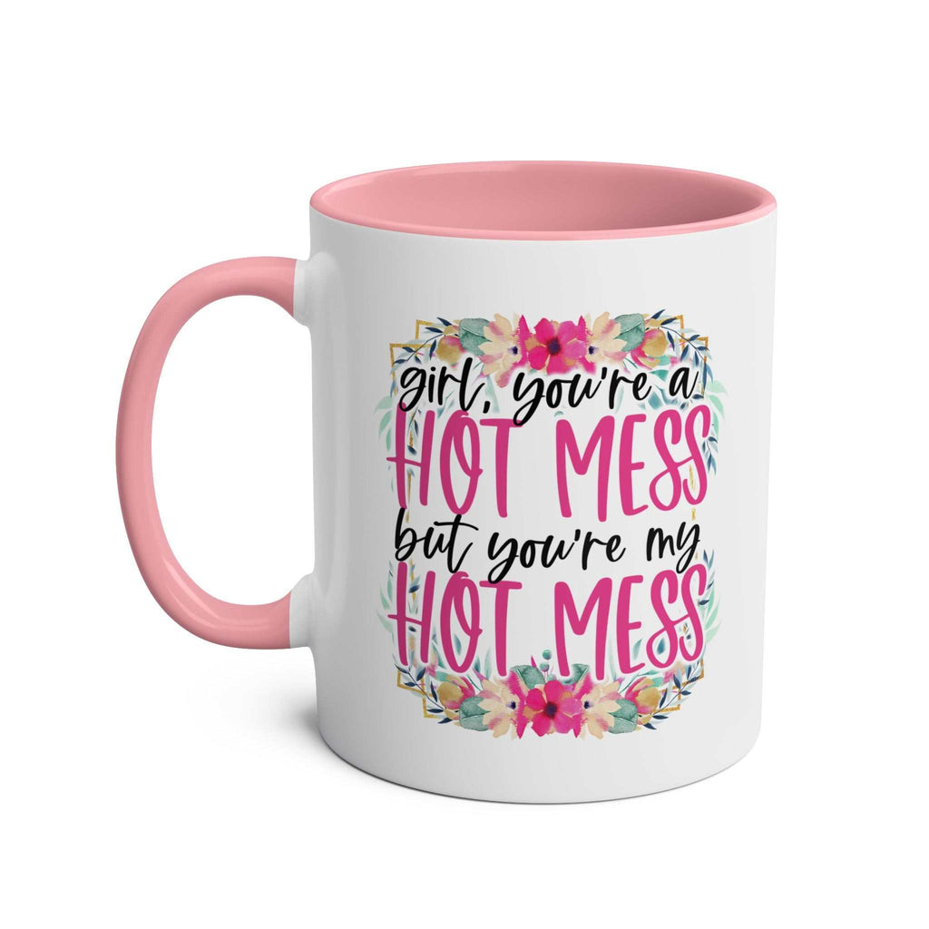 Hot Mess Coffee Mug with pink handle, colorful floral design, and playful slogan.