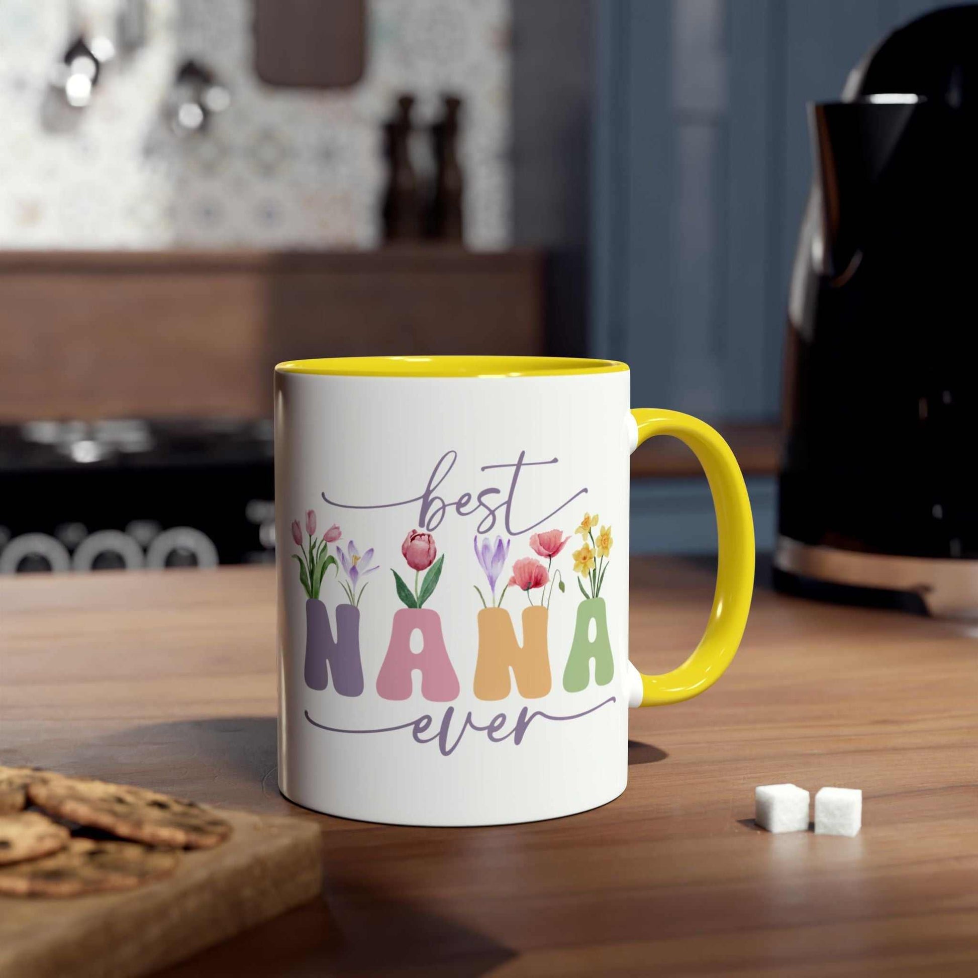 Best Nana Ever Mother's Day gift mug with floral design, yellow handle, glossy finish, 11oz ceramic, microwave and dishwasher safe.