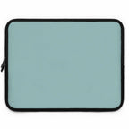 Teal green neoprene laptop sleeve with black trim, dual zipper, lightweight and waterproof protection.