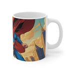 White ceramic Superman inspired coffee mug with glossy finish and colorful superhero design against a city skyline background, 11oz capacity.
