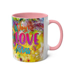 LGBTQ+ Pride Mug with vibrant rainbow design and pink handle.