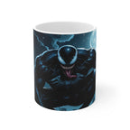 Glossy 11oz ceramic Venom-inspired coffee mug with vibrant villain design, microwave and dishwasher safe.