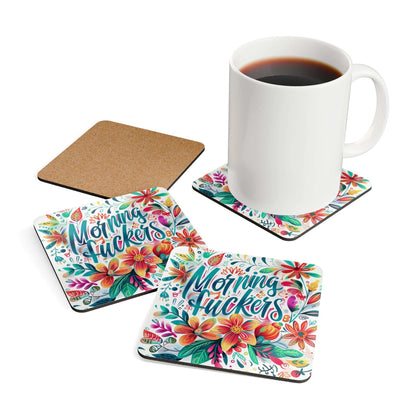Colorful "Morning Fuckers" coaster set with floral design, cork backing, and high-gloss finish, displayed with a white mug.