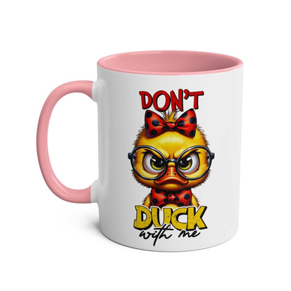 Humorous "Don't Duck With Me" coffee mug with grumpy duck design, pink handle.