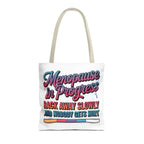 Menopause in Progress tote bag with cheeky design, durable polyester, and multiple sizes and handle colors