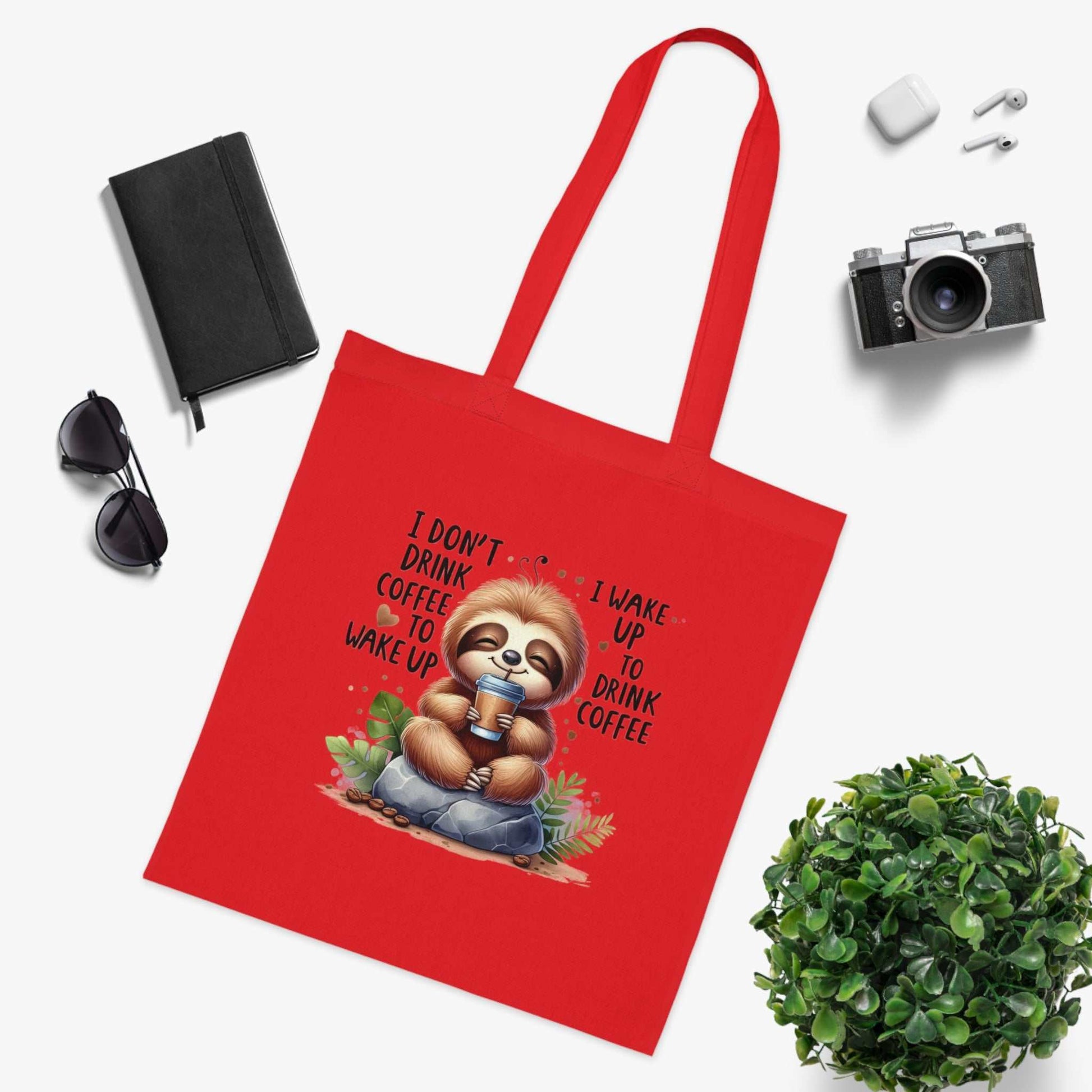 Cotton tote with cute sloth design, vibrant red color, perfect for carrying essentials.