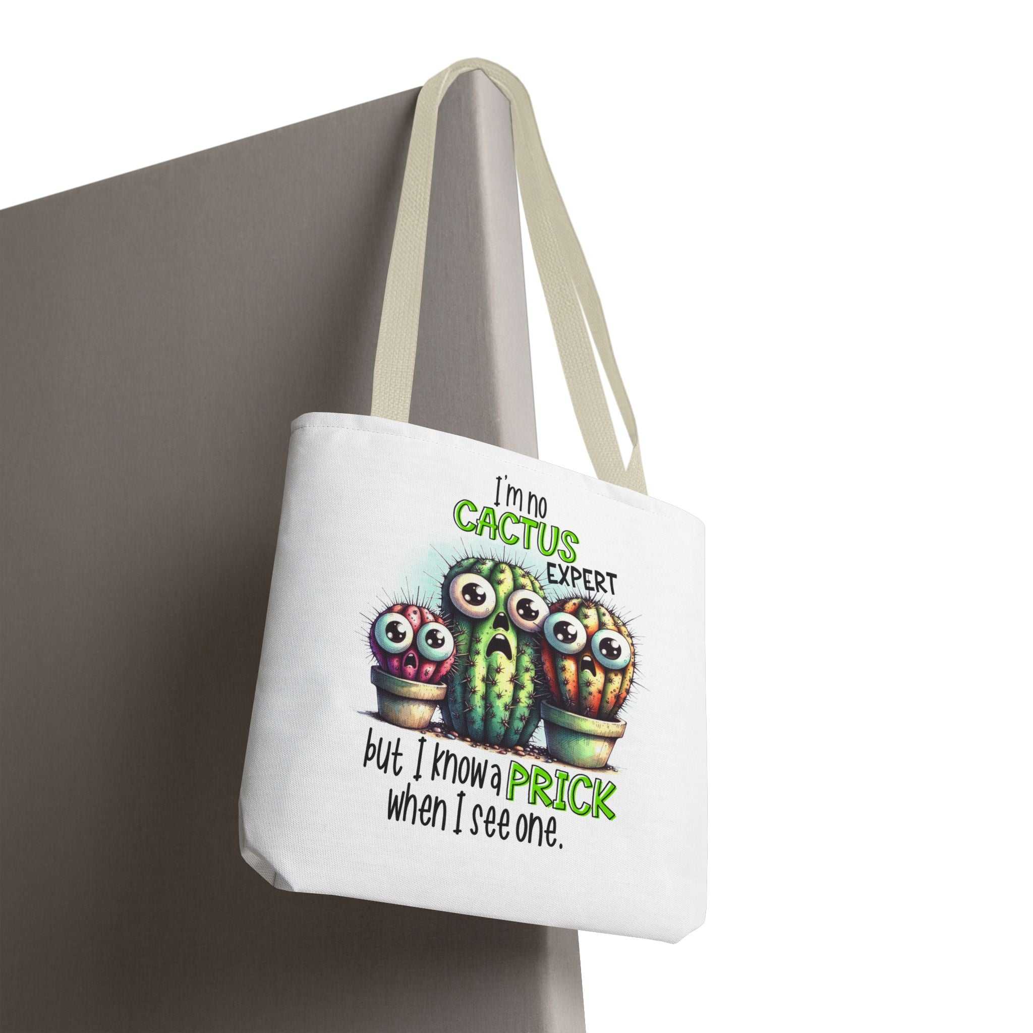 Fun cactus tote bag with cheeky design, durable spun polyester, and multiple handle colors.