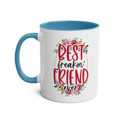 Best Freaking Friend Coffee Mug with fun design, floral accents, and blue interior.