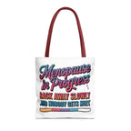 Menopause in Progress tote bag with cheeky design, durable spun polyester, multiple sizes and handle color options