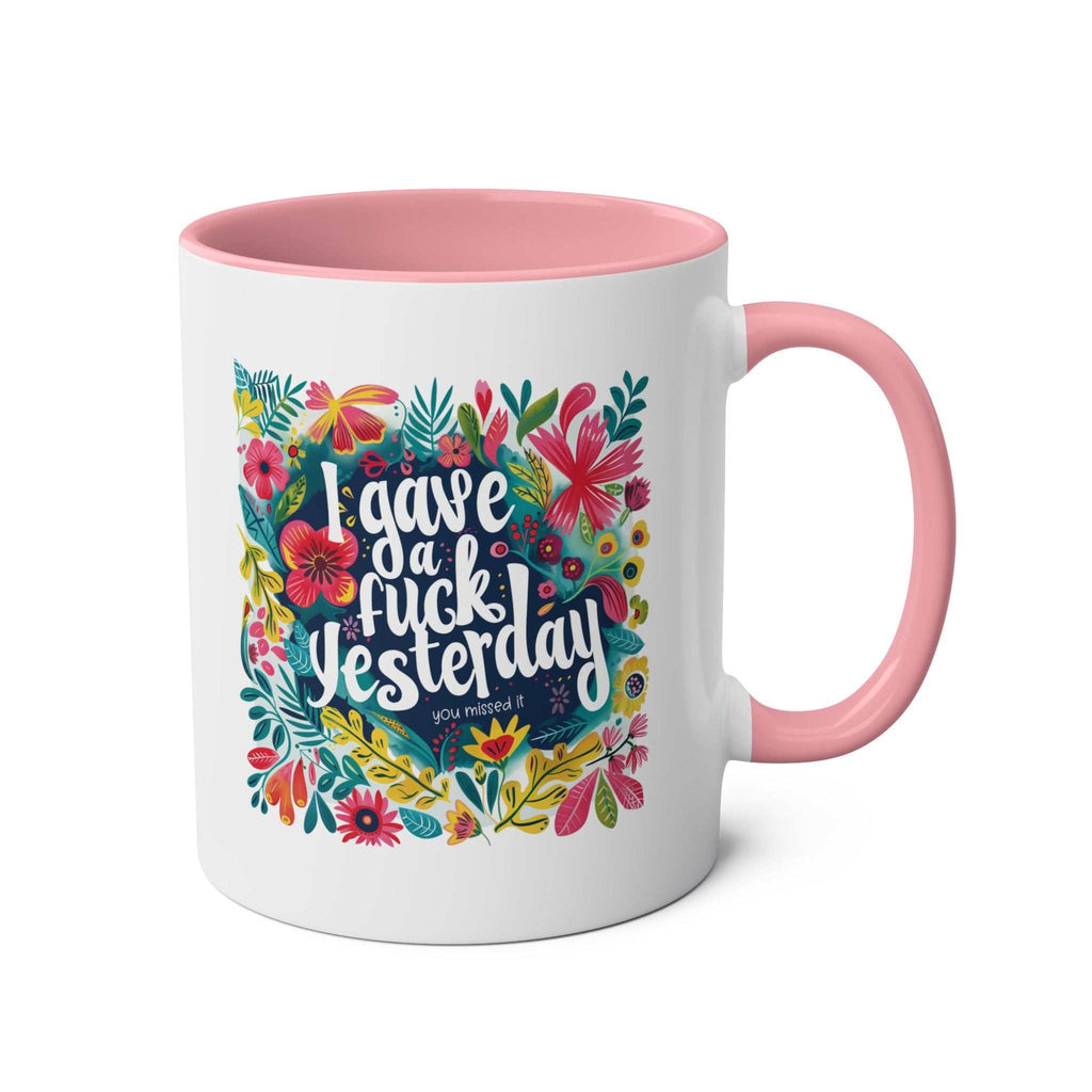 Colorful "I Gave a Fuck Yesterday" coffee mug with floral design, pink handle, and interior.