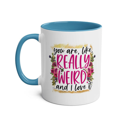 Really Weird Coffee Mug with colorful floral design and humorous text, perfect quirky gift.