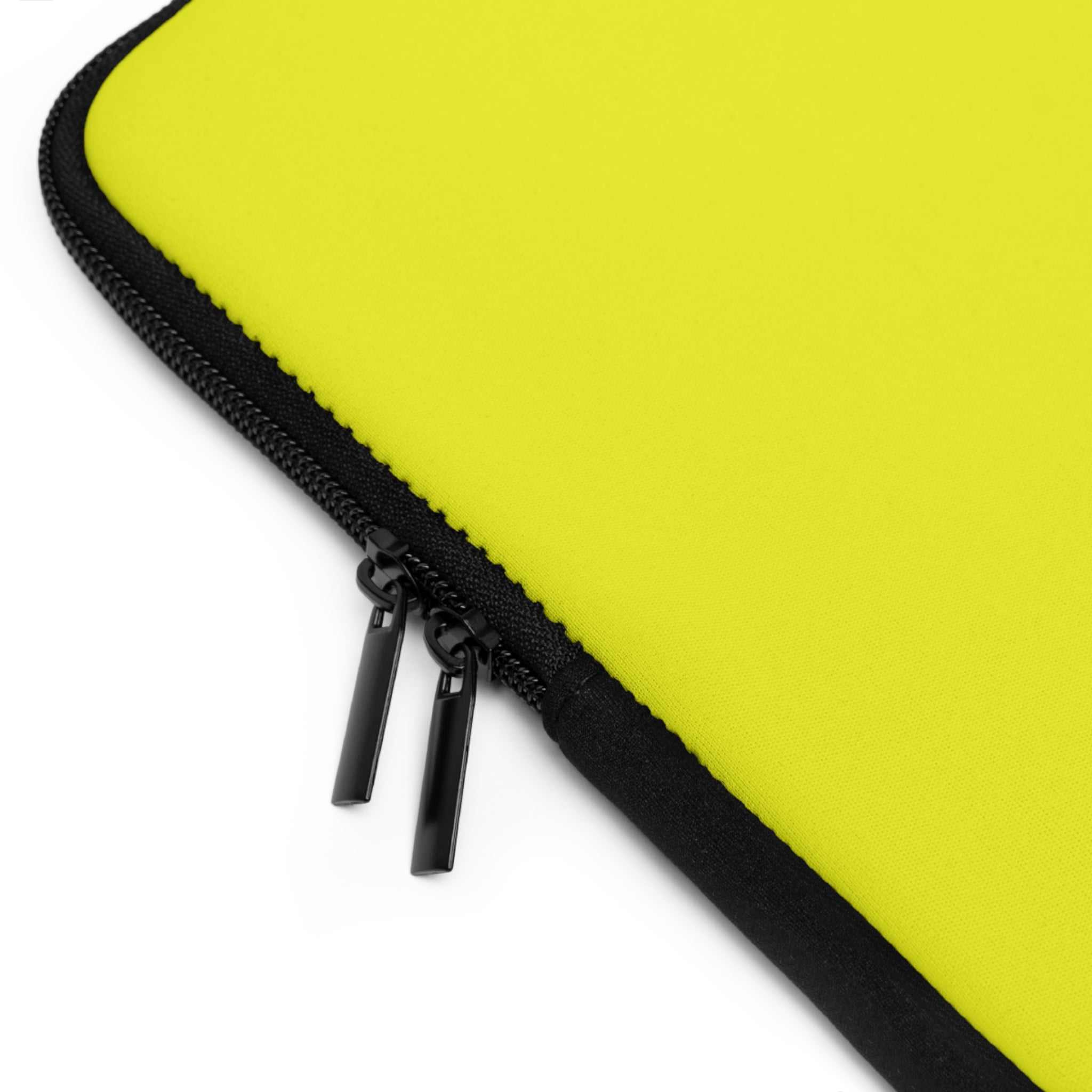 Close-up of yellow laptop sleeve with black dual zipper and neoprene material