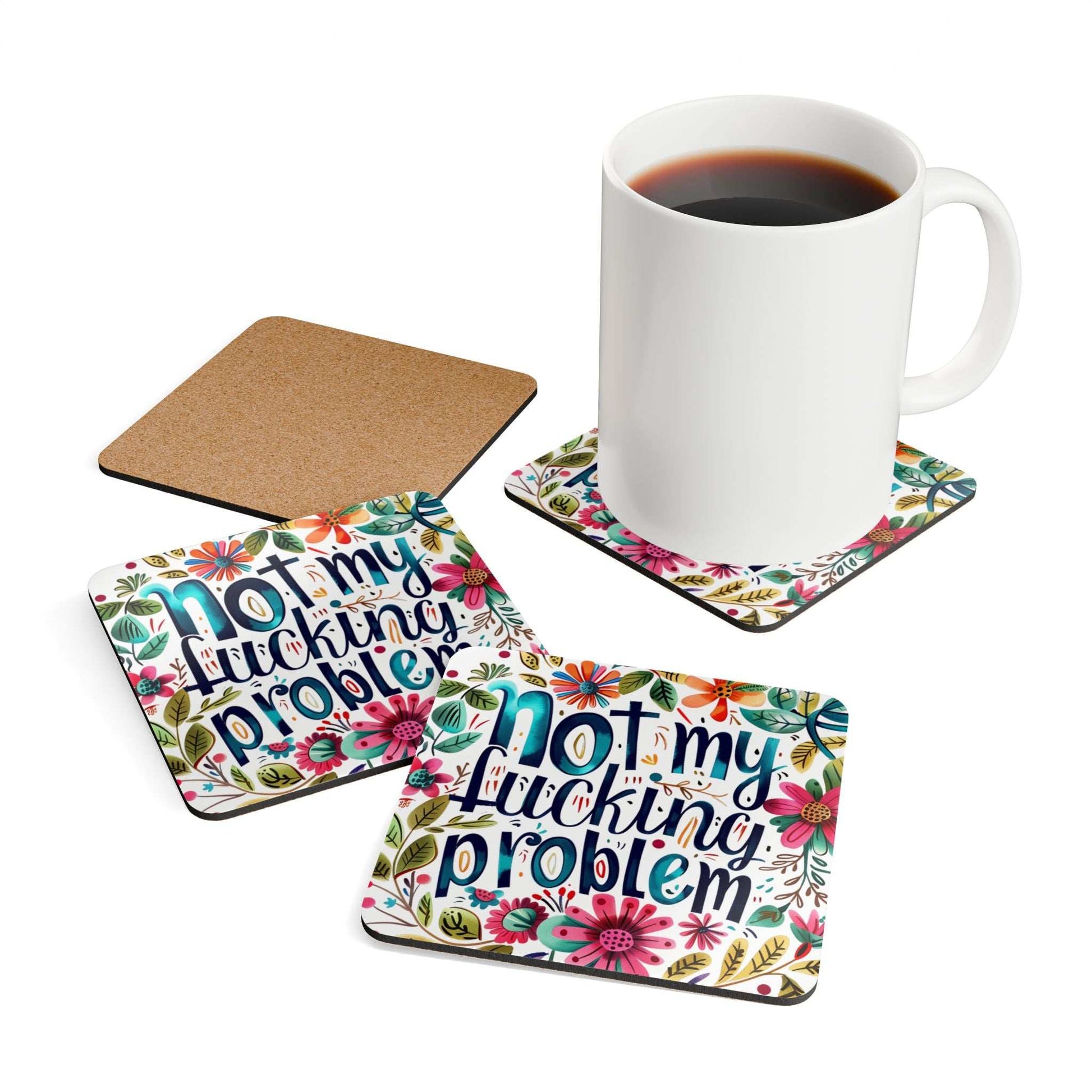 "Not My Fucking Problem" coaster set with floral design, high-gloss MDF top, and cork back, shown with a mug.