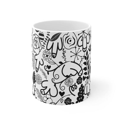 White ceramic mug with black cheeky flower willy doodle design, glossy finish, 11oz capacity, microwave and dishwasher safe