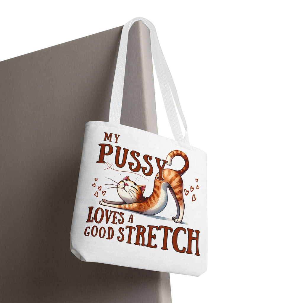 Fun stretching cat tote bag with cheeky design and multiple handle color options