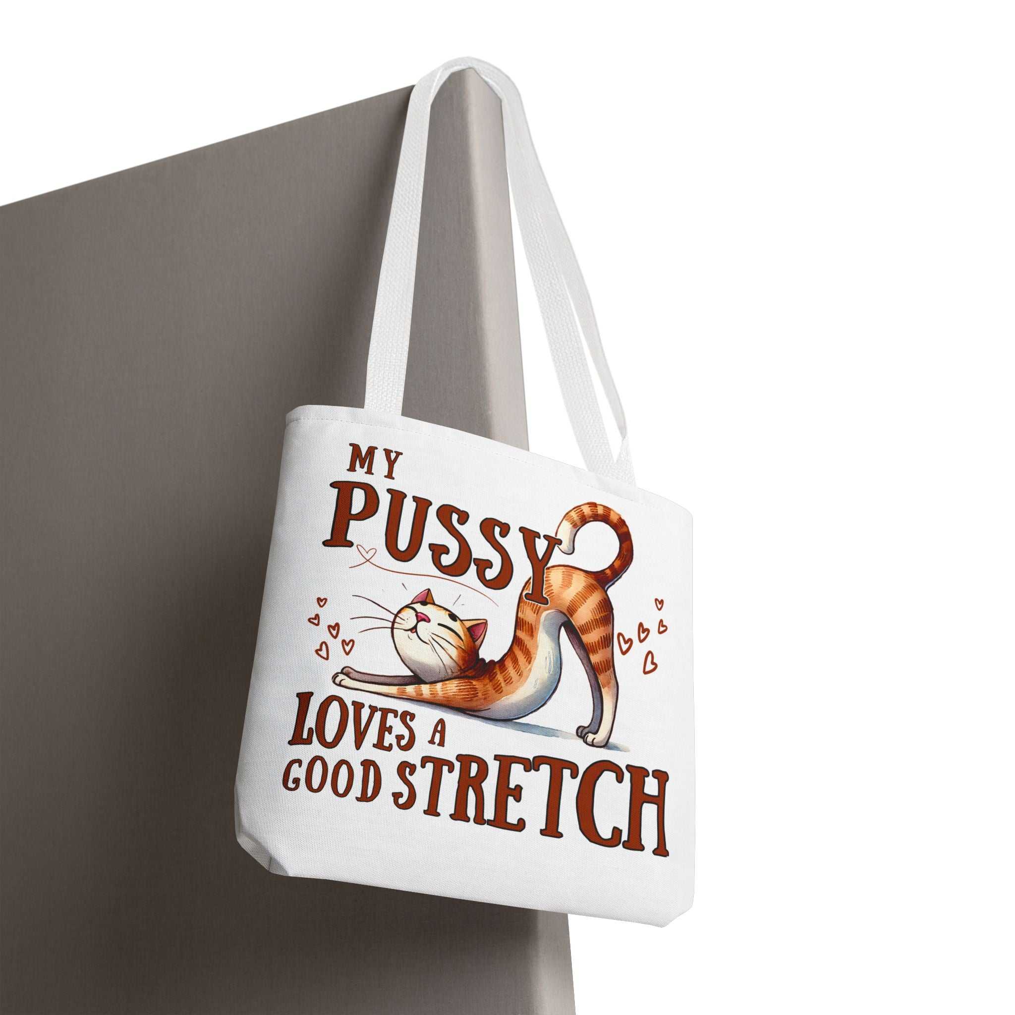 Fun stretching cat tote bag with cheeky design and multiple handle color options