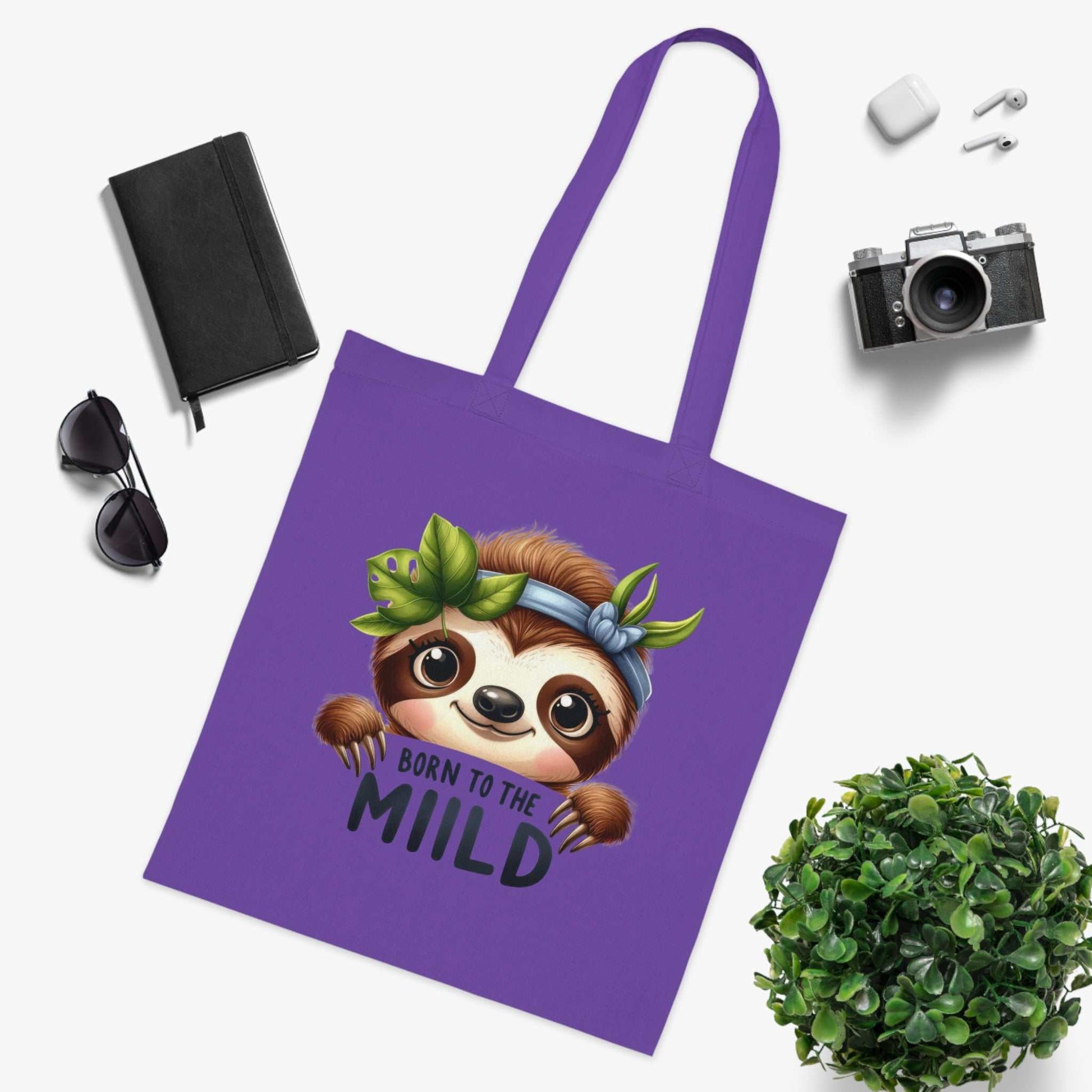 Cotton tote bag with cute sloth design, vibrant colors, and sturdy handles, ideal for sloth lovers.