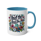 Shut The Fuck Up coffee mug with floral design, blue handle, and interior.