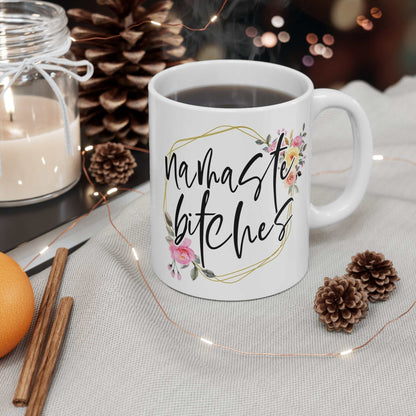 Namaste Bitches Ceramic Mug with floral design, glossy finish, 11oz white ceramic coffee cup, microwave and dishwasher safe.