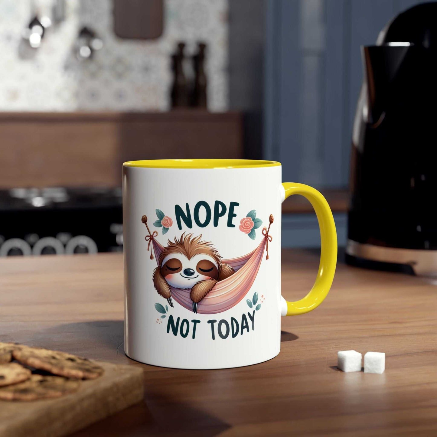 Cute sloth coffee mug with "Nope Not Today" design on a kitchen table.