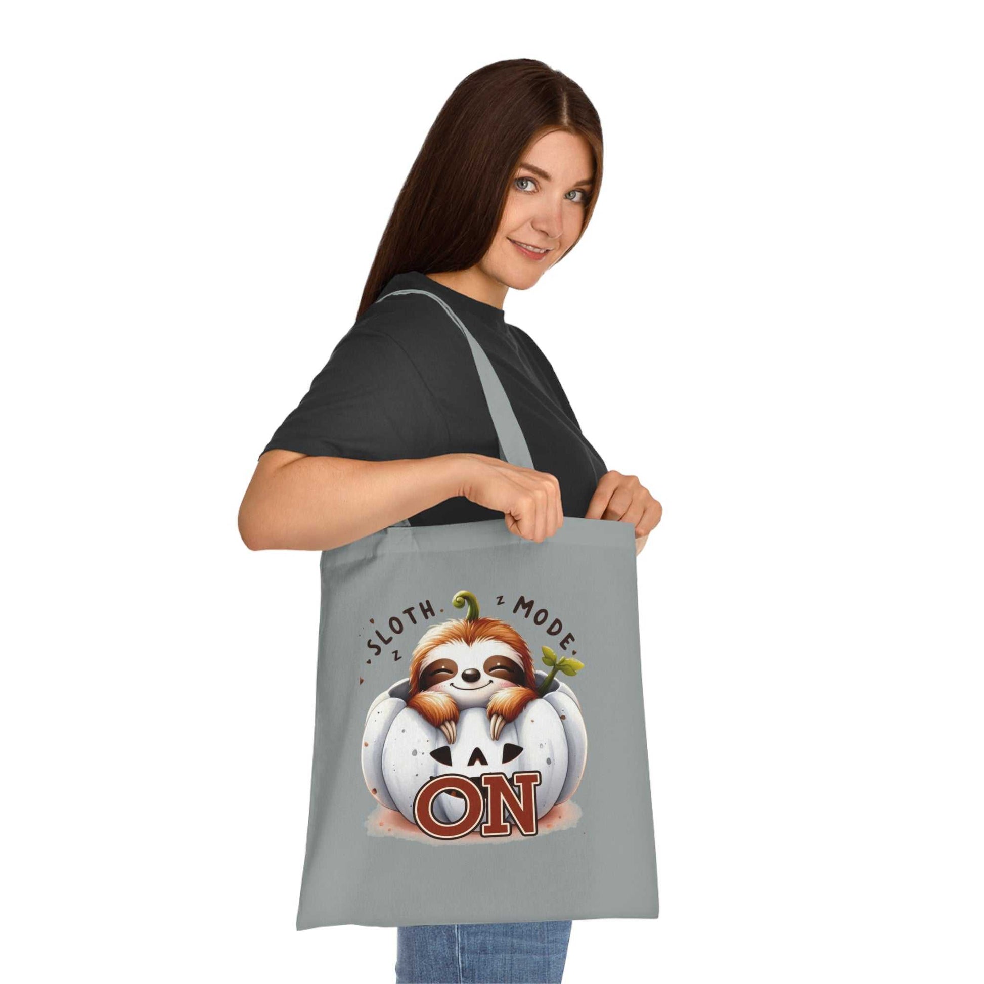 Cotton tote featuring a cute sloth design with vibrant colors, perfect for carrying essentials.