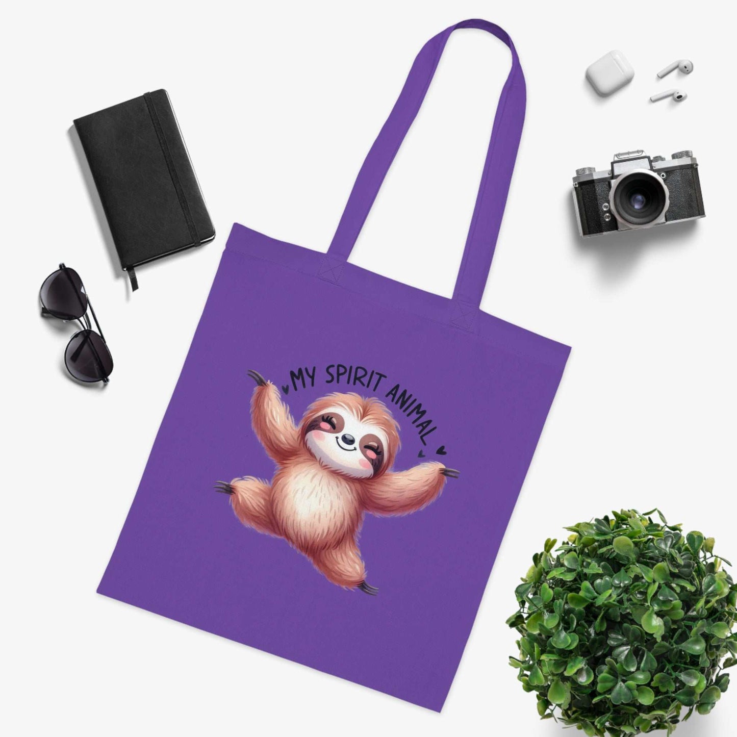 Cotton tote bag with cute sloth design, vibrant colors, 100% cotton, ideal for everyday use.