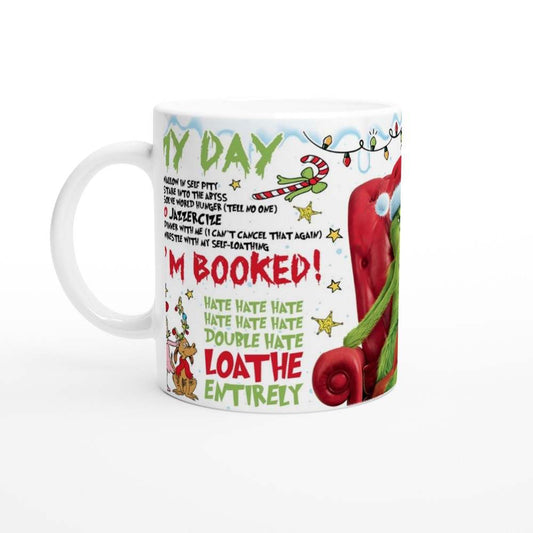 Grinch Im Booked Christmas Mug with festive design, 11oz ceramic, glossy finish.