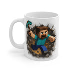 White ceramic 11oz mug featuring a pixelated Minecraft Steve character breaking through a stone wall, microwave and dishwasher safe with a glossy finish.