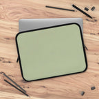 sage green neoprene laptop sleeve with black trim and dual zipper, lightweight and waterproof protective case for laptops