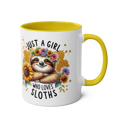 Cute sloth coffee mug with floral design and yellow handle, perfect for sloth lovers.