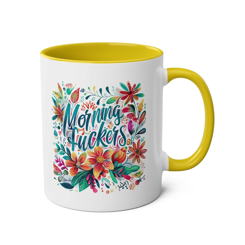 Cheeky floral "Morning Fuckers" coffee mug with yellow handle.