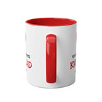 Ceramic mug with red handle and inside, featuring a fun "Knobhead" design.
