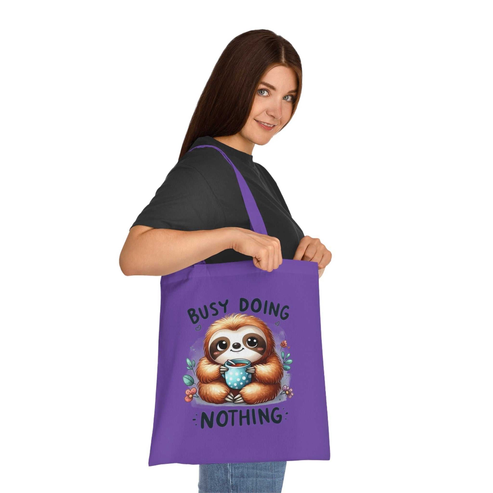 Cotton tote with cute sloth design, vibrant colors, and reinforced handles, perfect for sloth lovers.