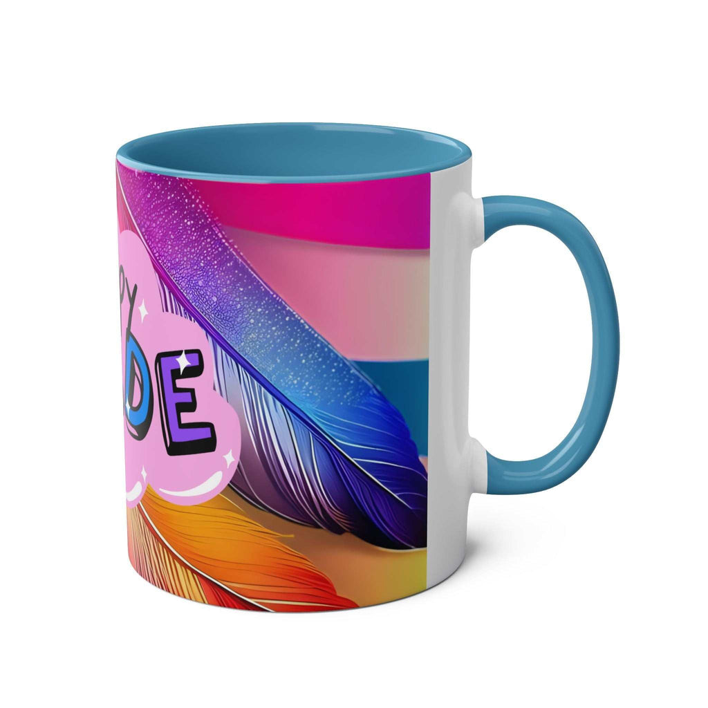 LGBTQ+ Pride mug with vibrant rainbow design, blue handle, high-quality ceramic, 11oz capacity.